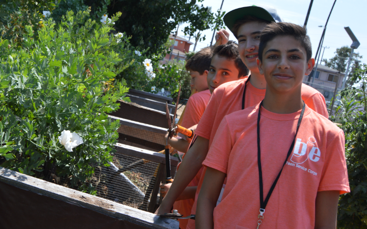 Youth standing together in a garden